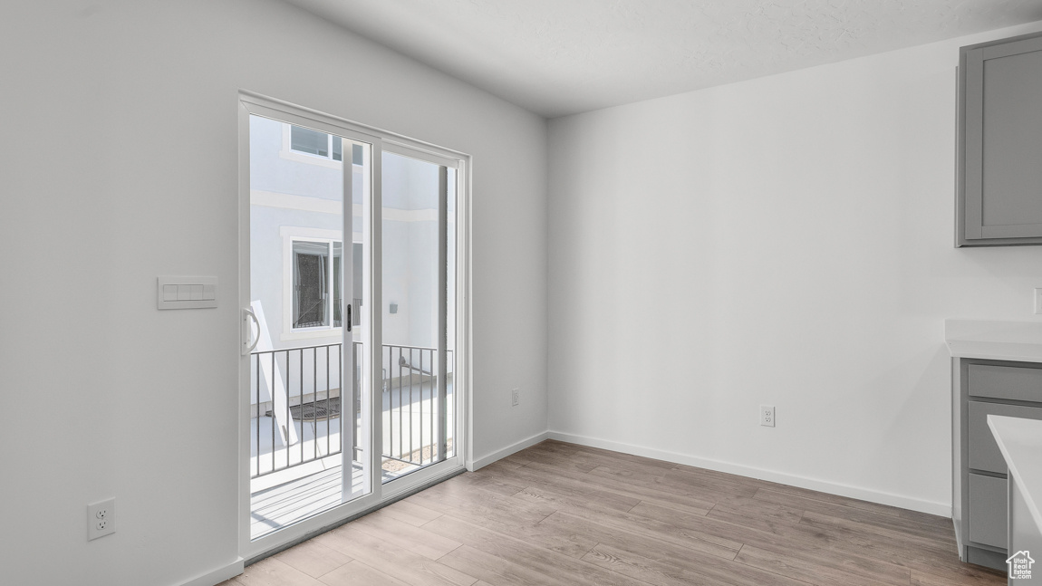 Interior space with light wood-type flooring and baseboards