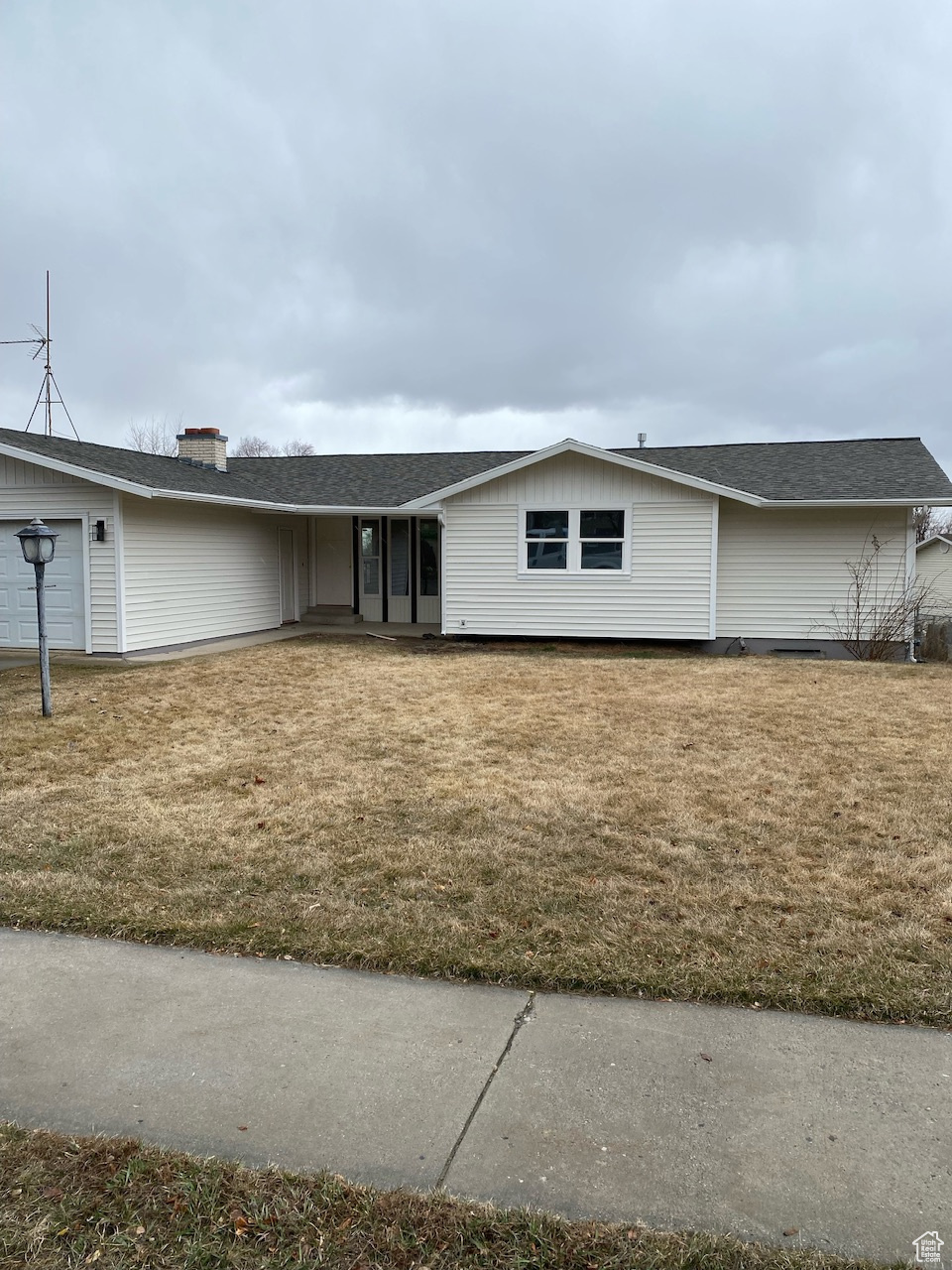 View of front of house with a front yard