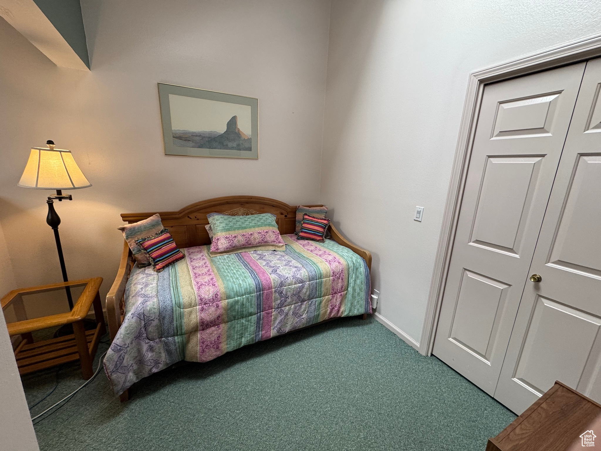 Bedroom with baseboards and carpet floors