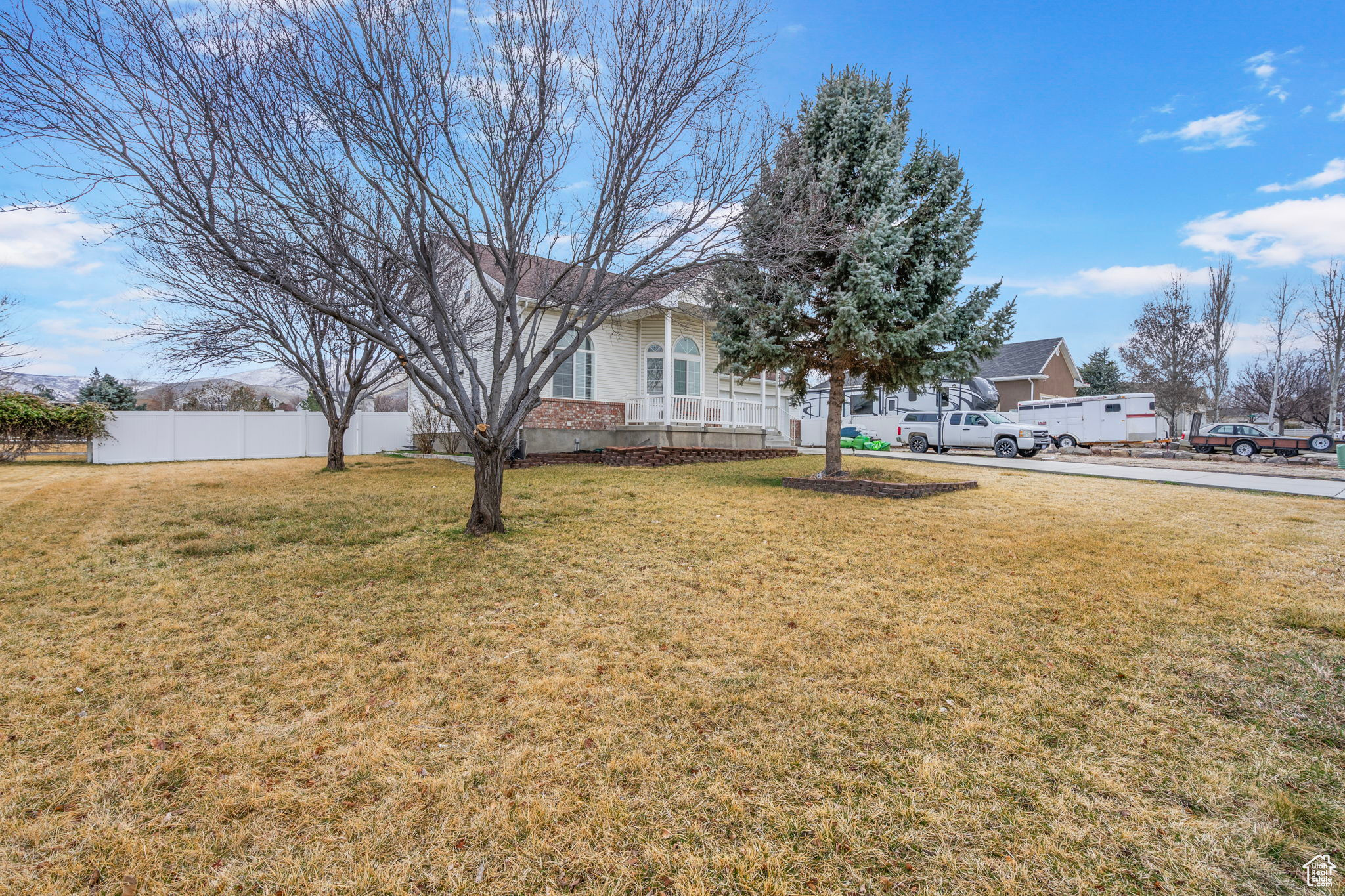 View of yard featuring fence