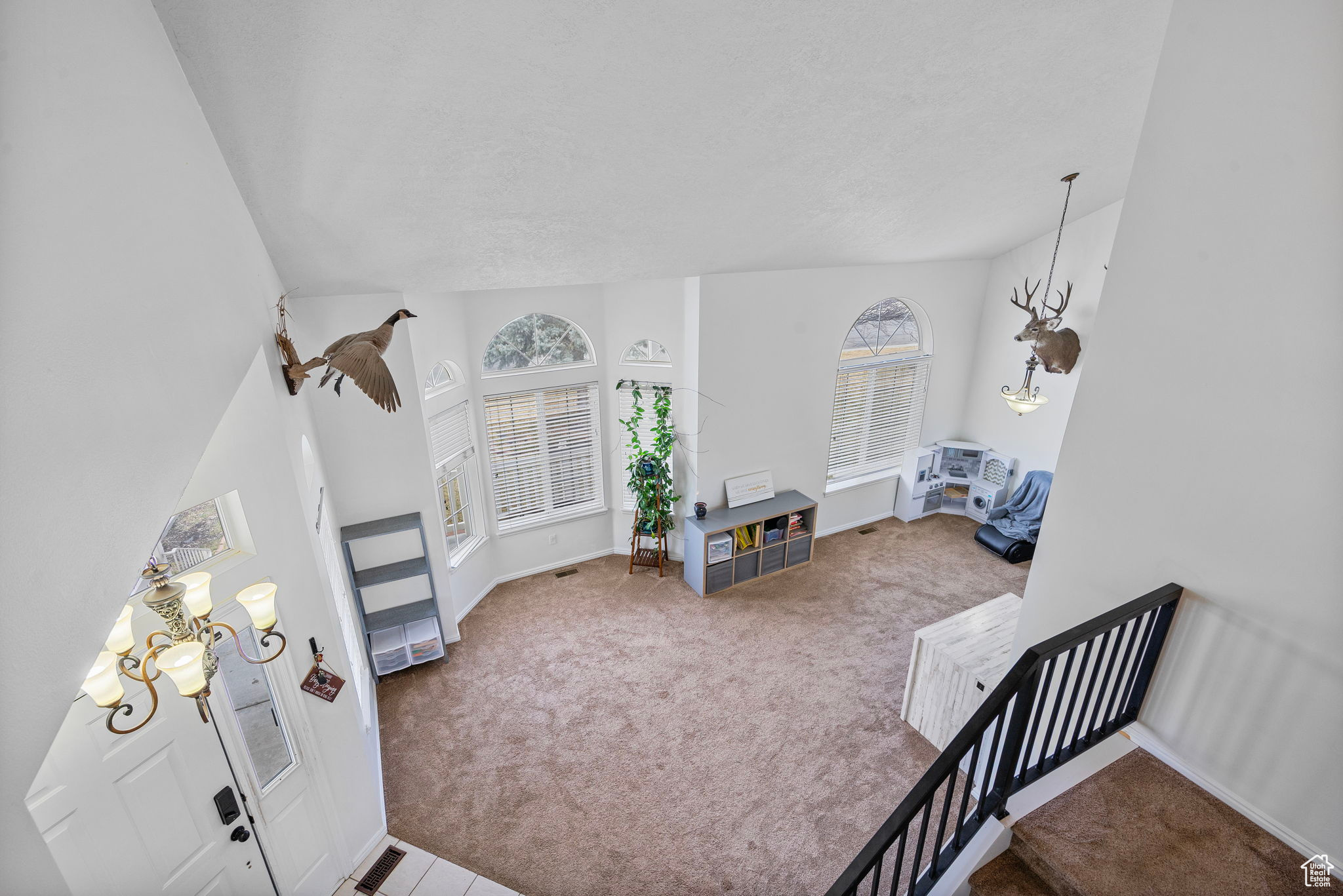 Carpeted living room with baseboards