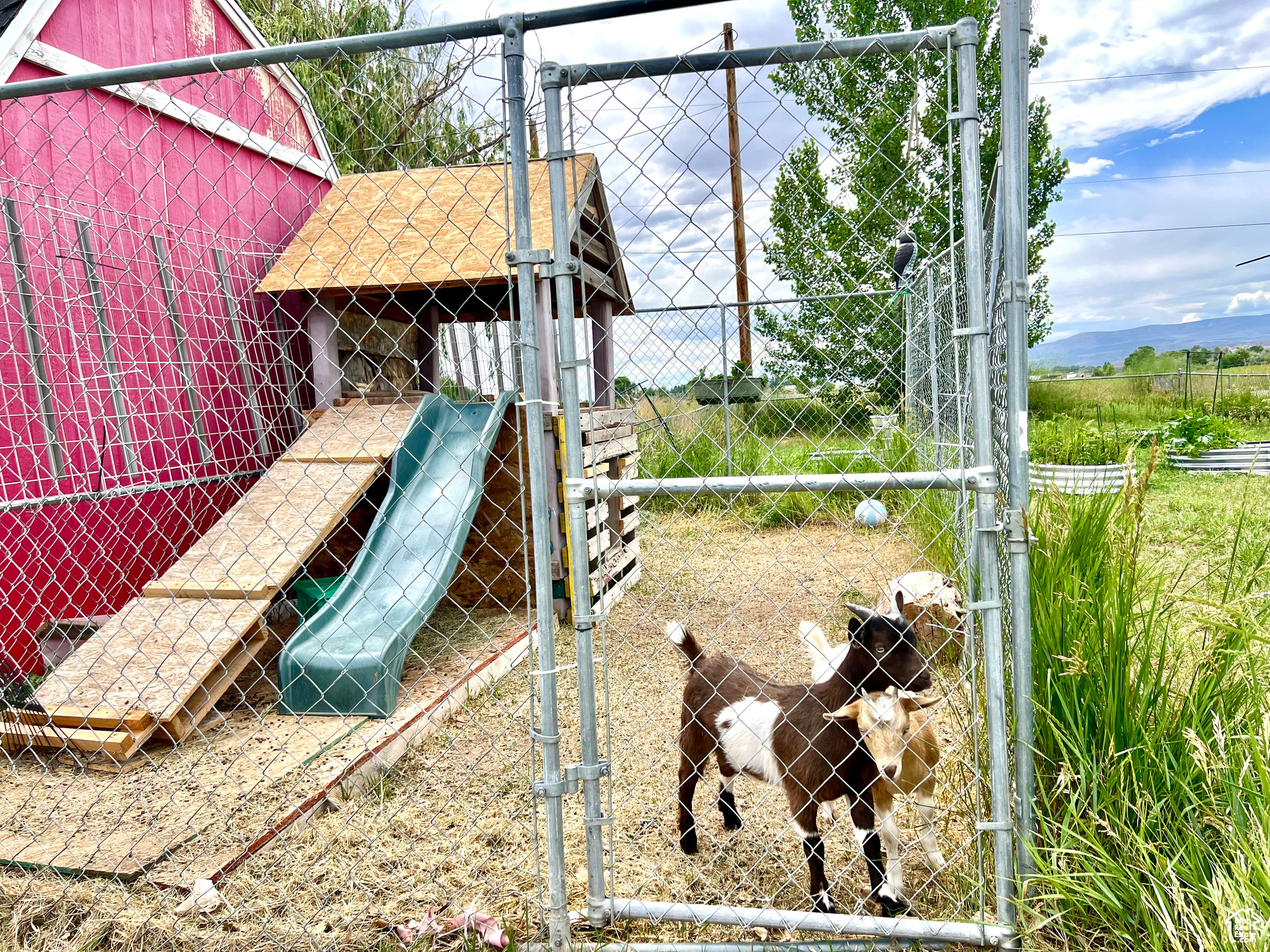 View of playground featuring fence