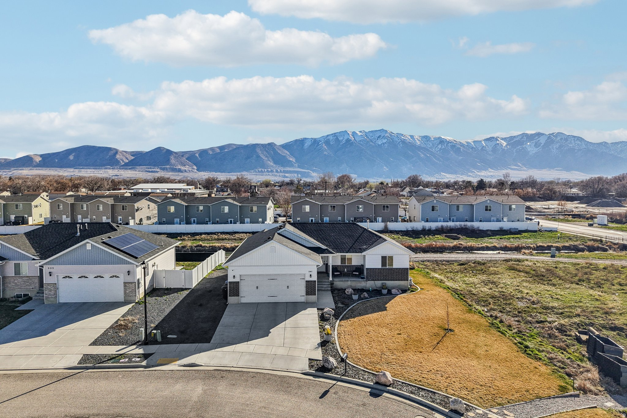 Aerial view of residential area featuring mountains