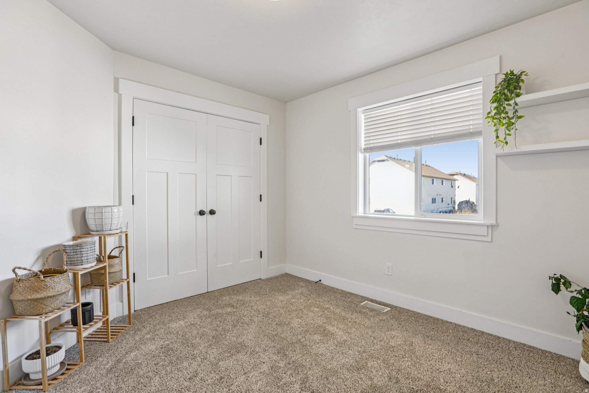 Unfurnished bedroom featuring a closet and carpet