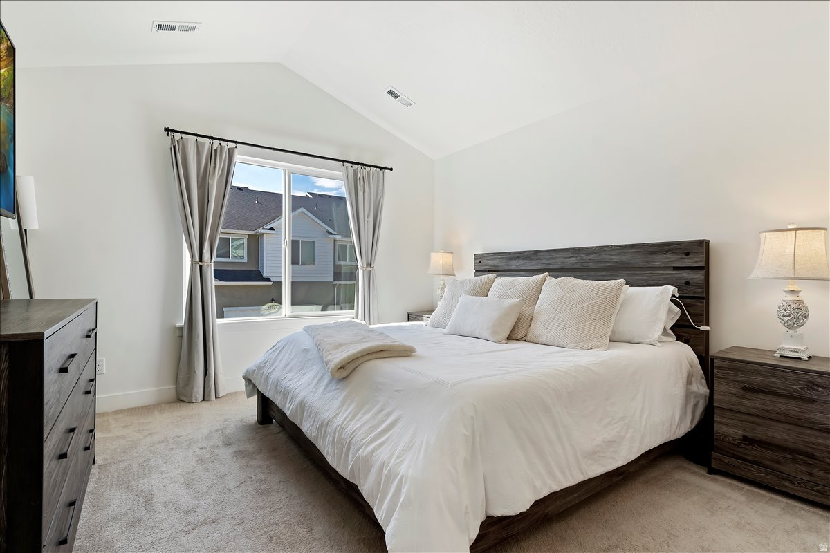 Bedroom with light carpet