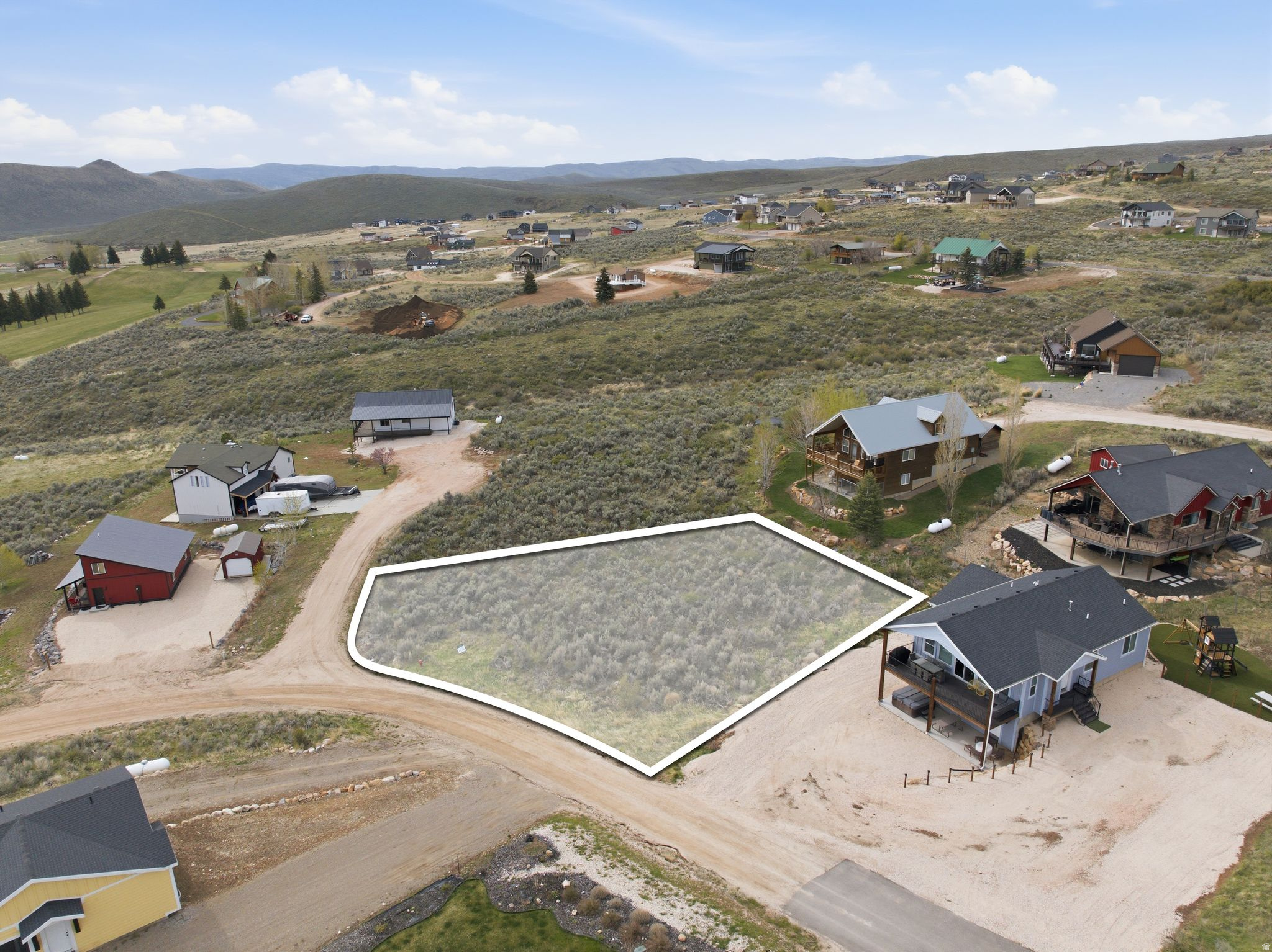 View of property location featuring property parcel outlined and nearby suburban area