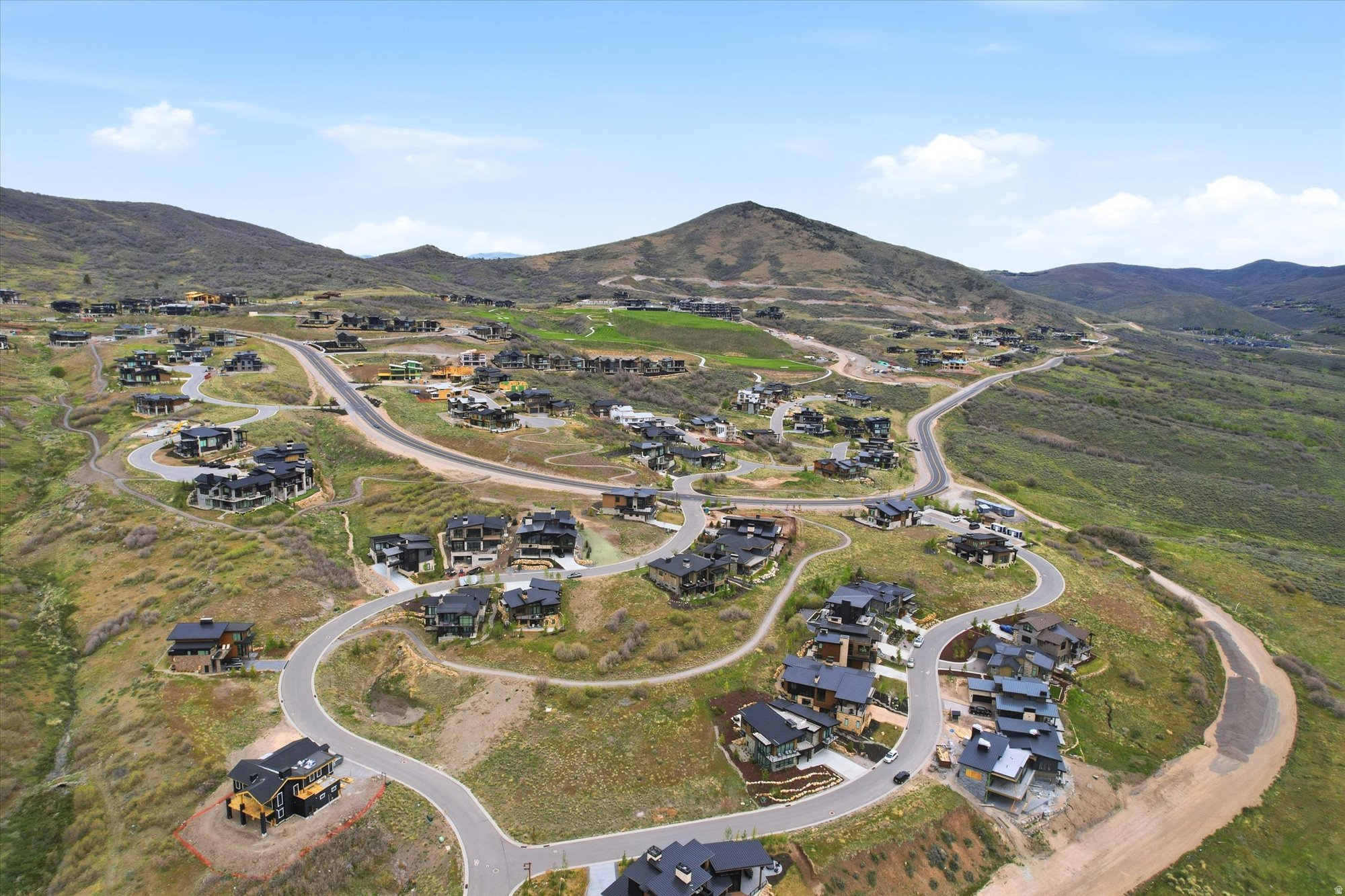Expansive mountain community showcasing numerous contemporary residences
