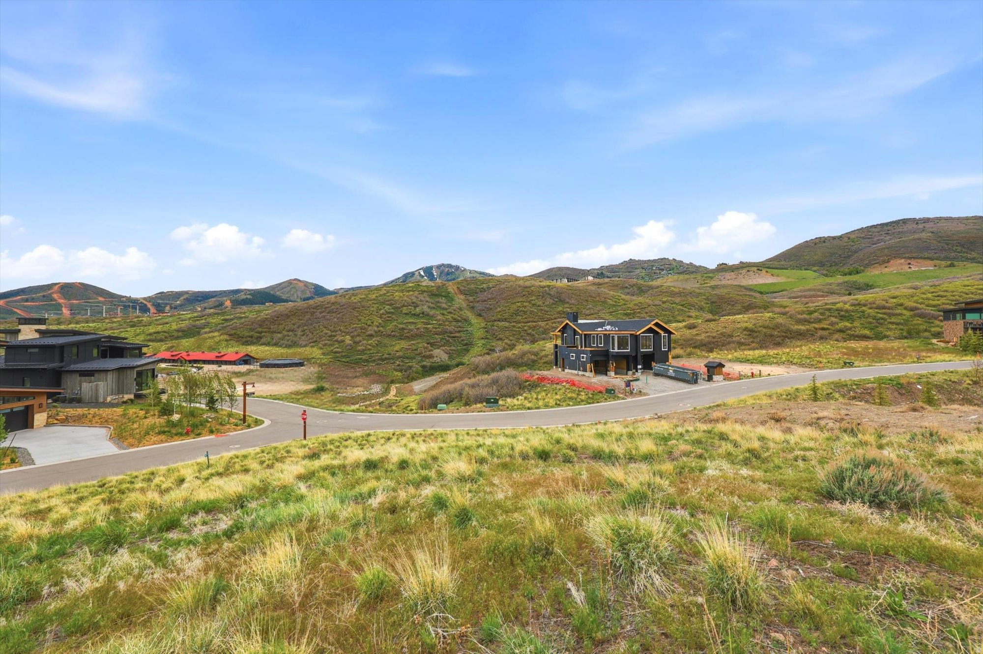 Hillside setting with distant mountainous terrain