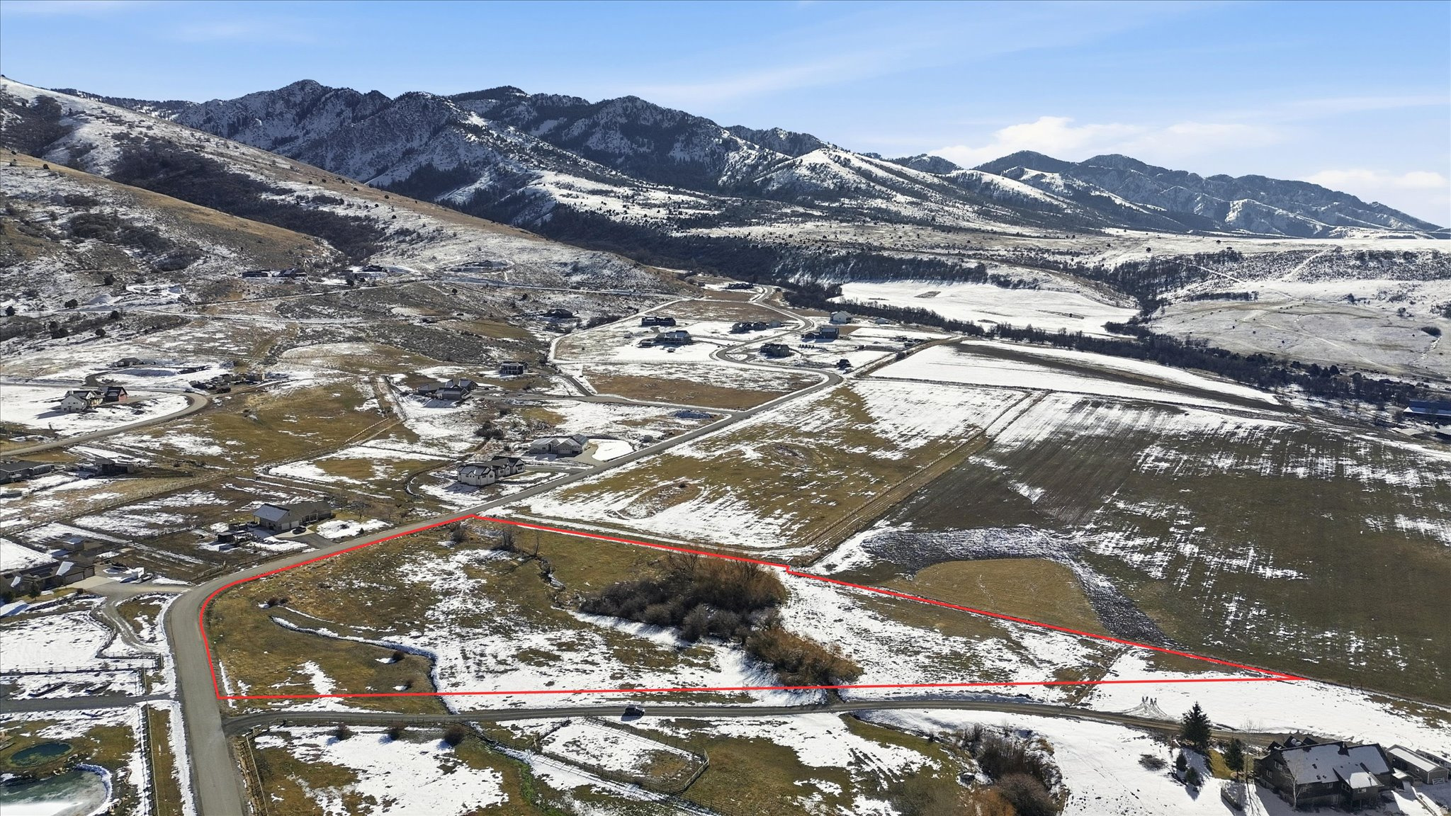 Expansive land parcel featuring varied topography and natural vegetation