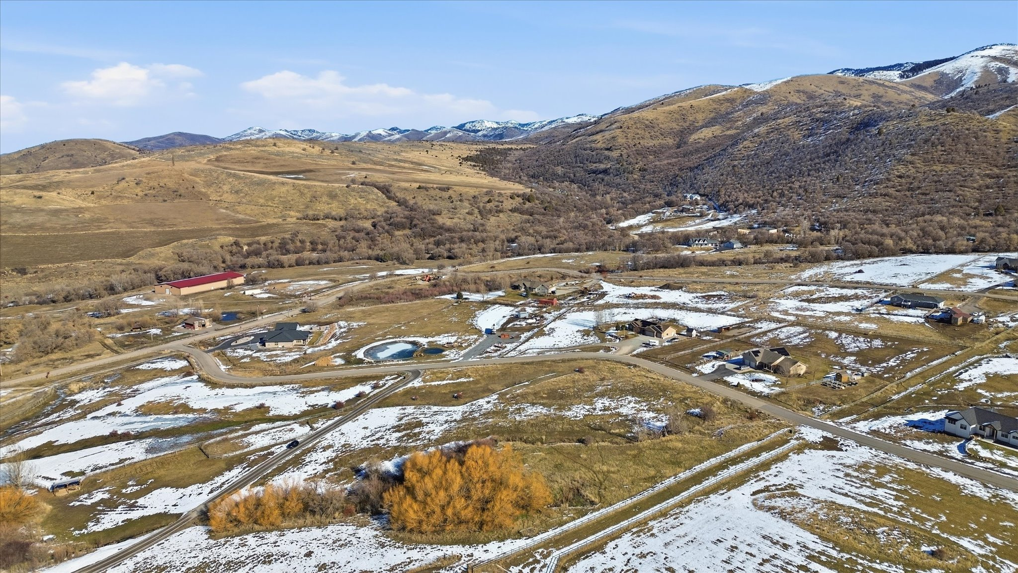 Sprawling land parcels featuring varied topography and scattered residential structures
