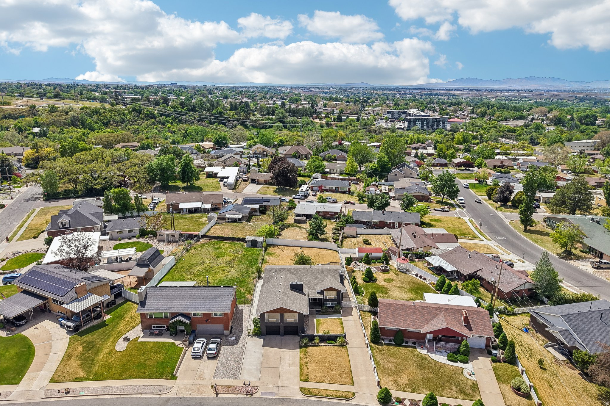 Expansive aerial perspective showcasing a residential area with varied housing styles