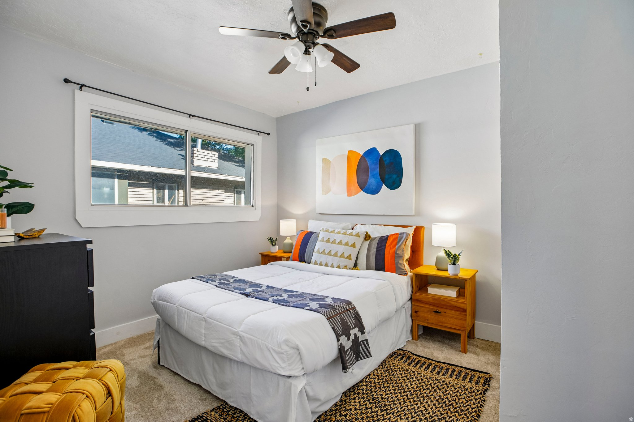 Bedroom featuring a ceiling fan, light gray wall paint, and carpet flooring