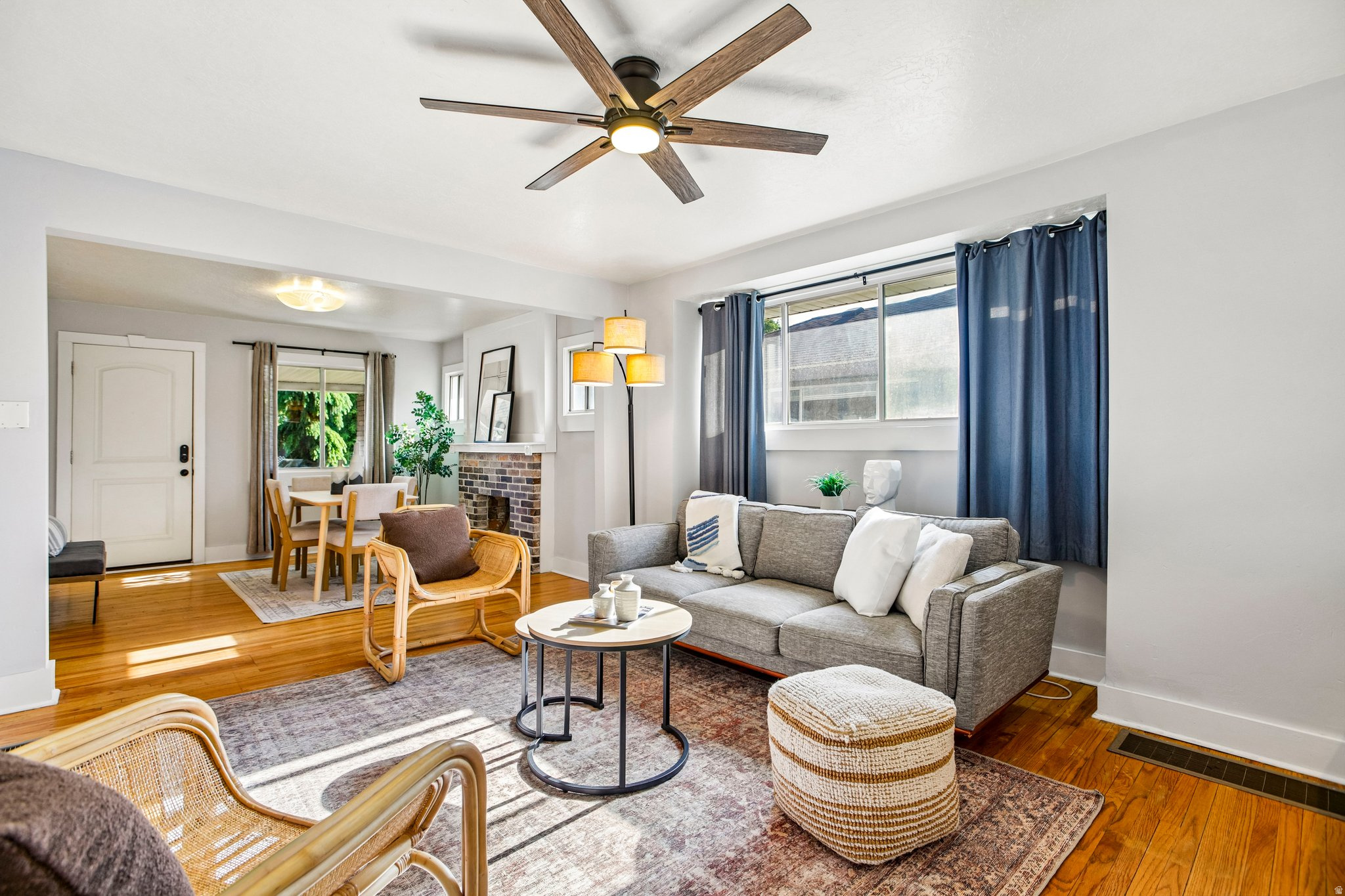 Open concept living area featuring wood-finish flooring