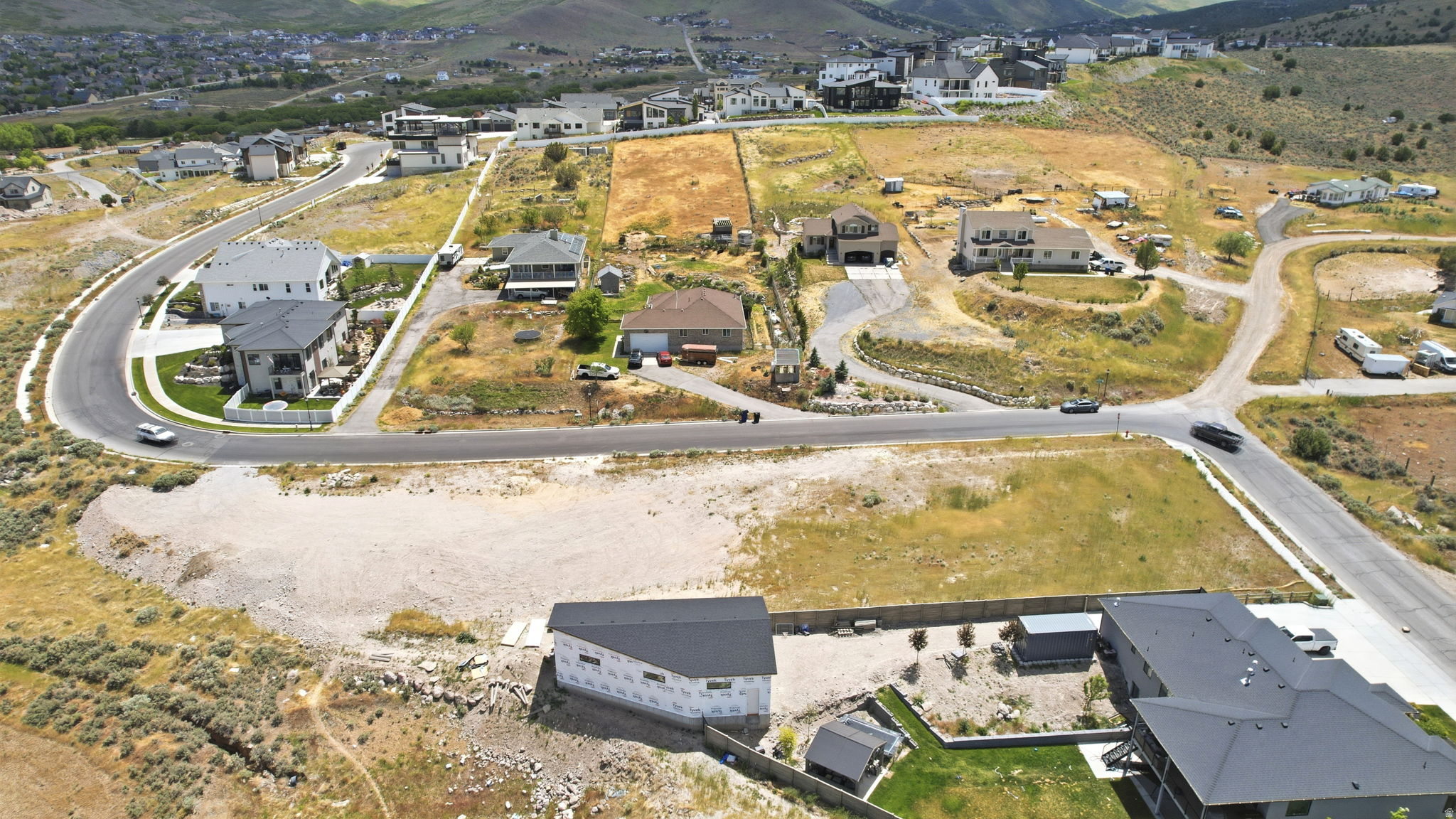 Elevated residential development featuring existing homes and construction sites