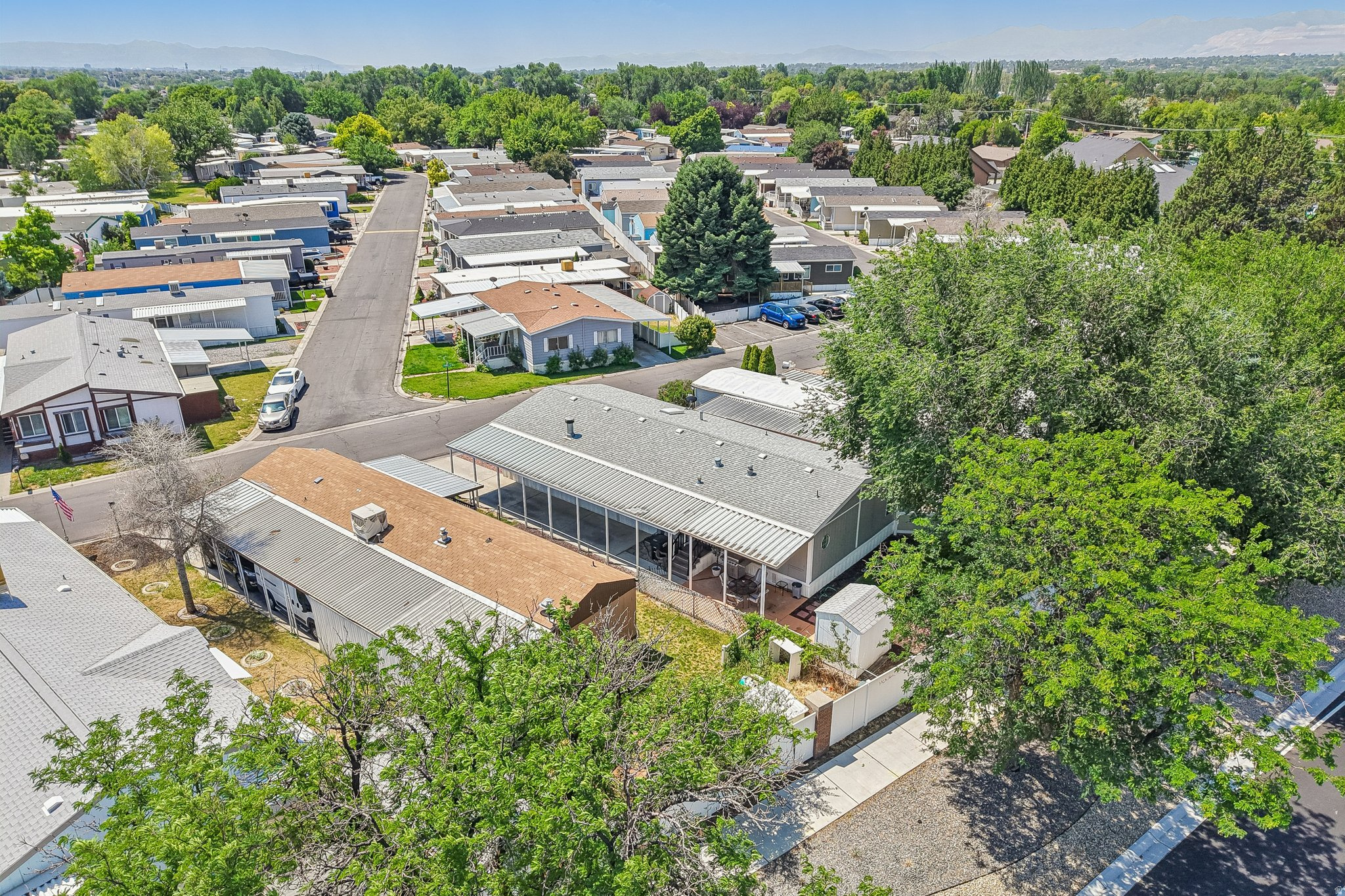 Aerial perspective showcasing a residential community with mature landscaping