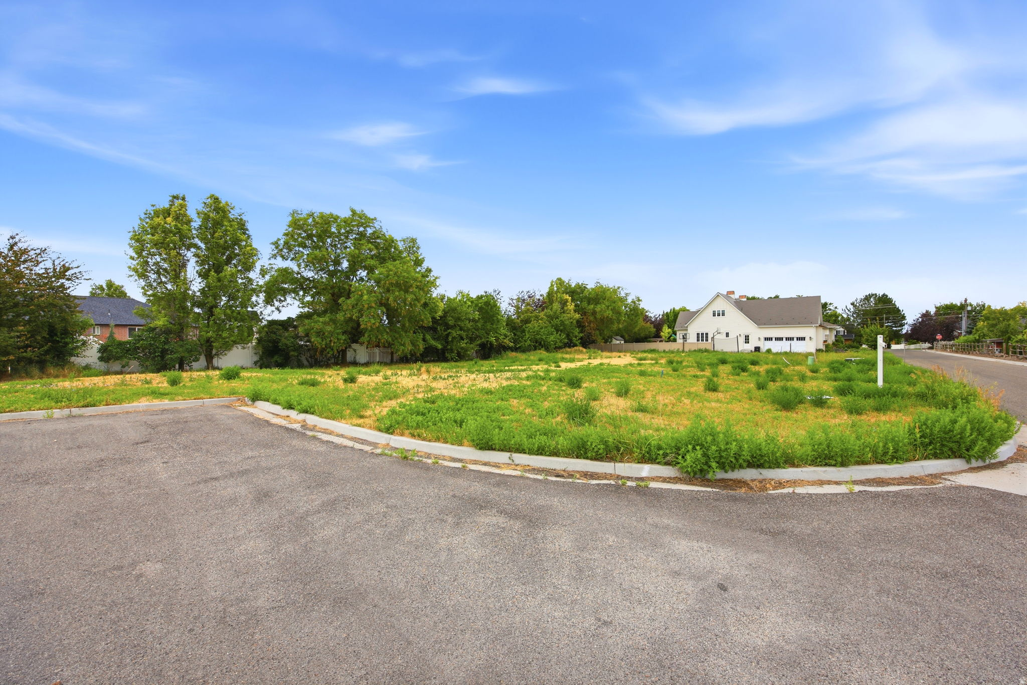 Expansive lot featuring a cleared building envelope and mature perimeter trees
