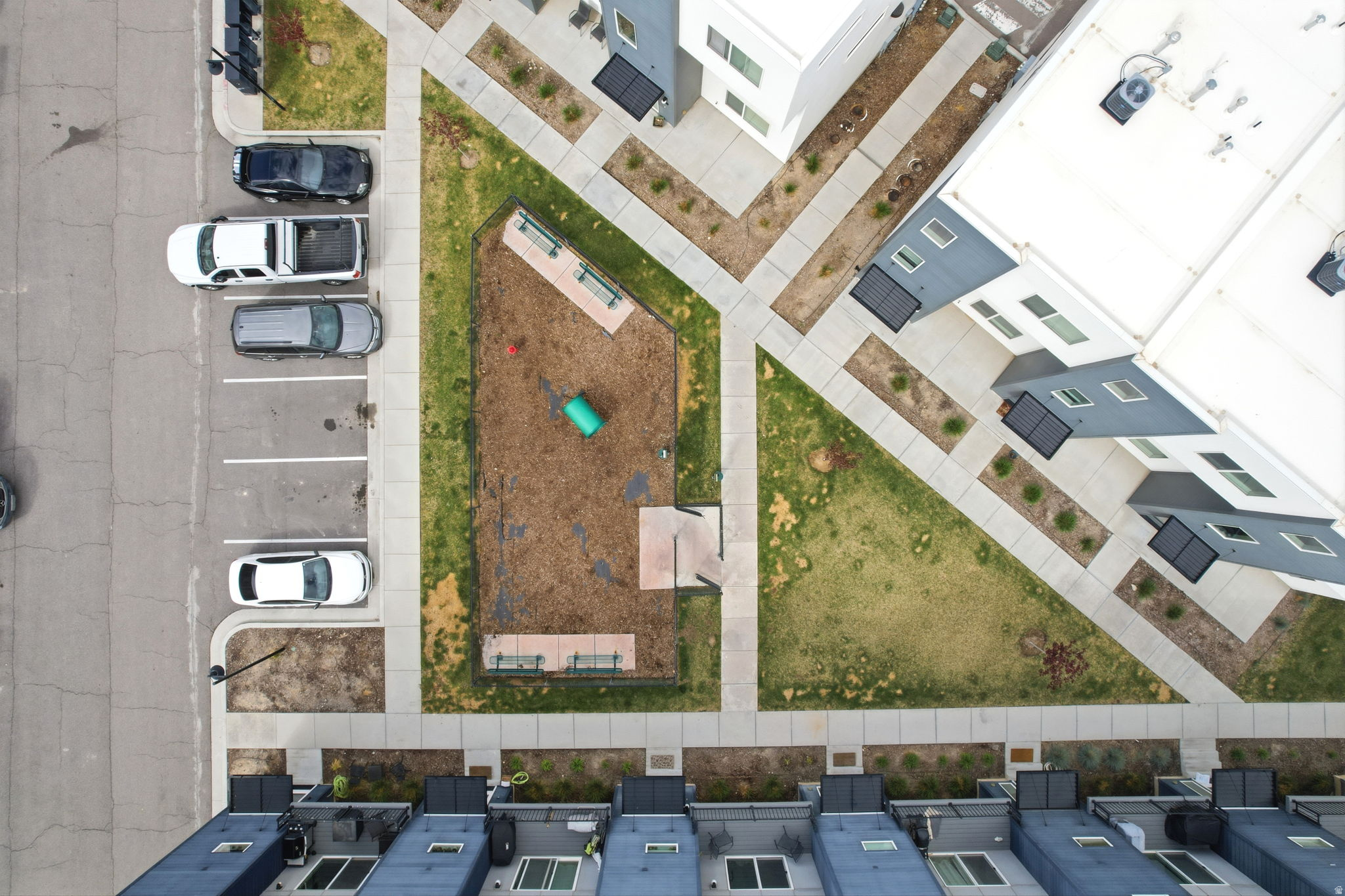 Aerial perspective of a modern residential community featuring contemporary architecture