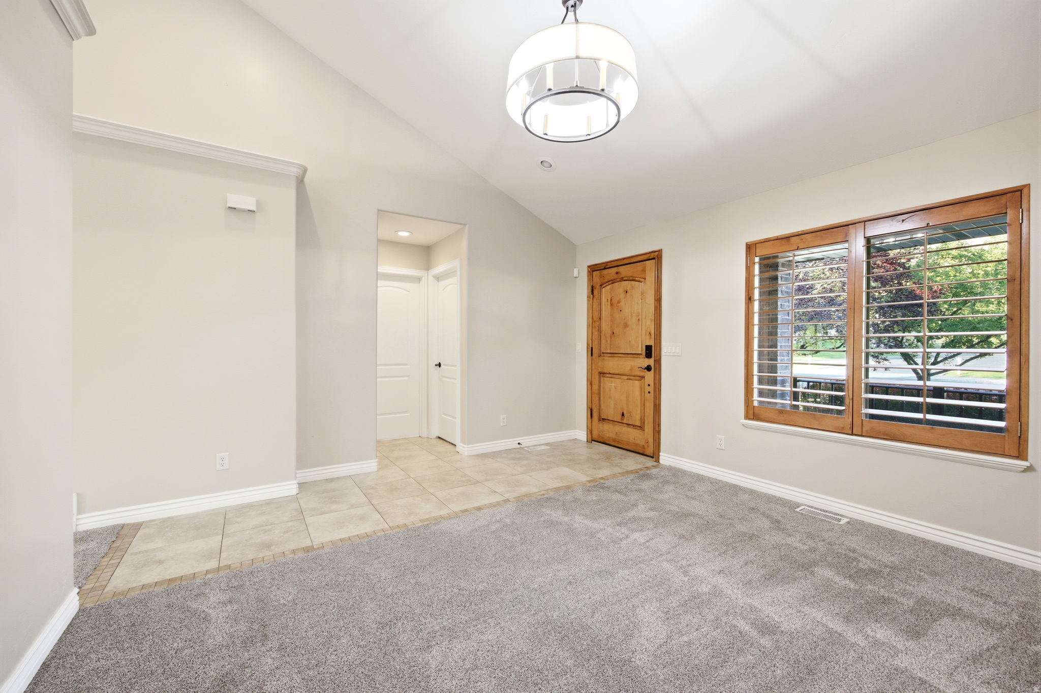 Entry with view of entrance to second bedroom and bathroom