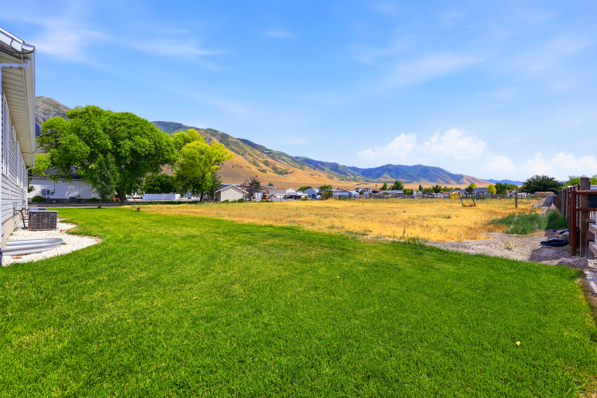 Expansive lawn with mountain backdrop