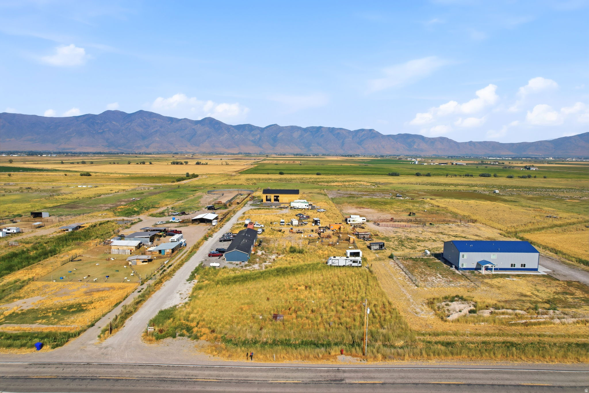 Expansive rural setting with a mountain backdrop
