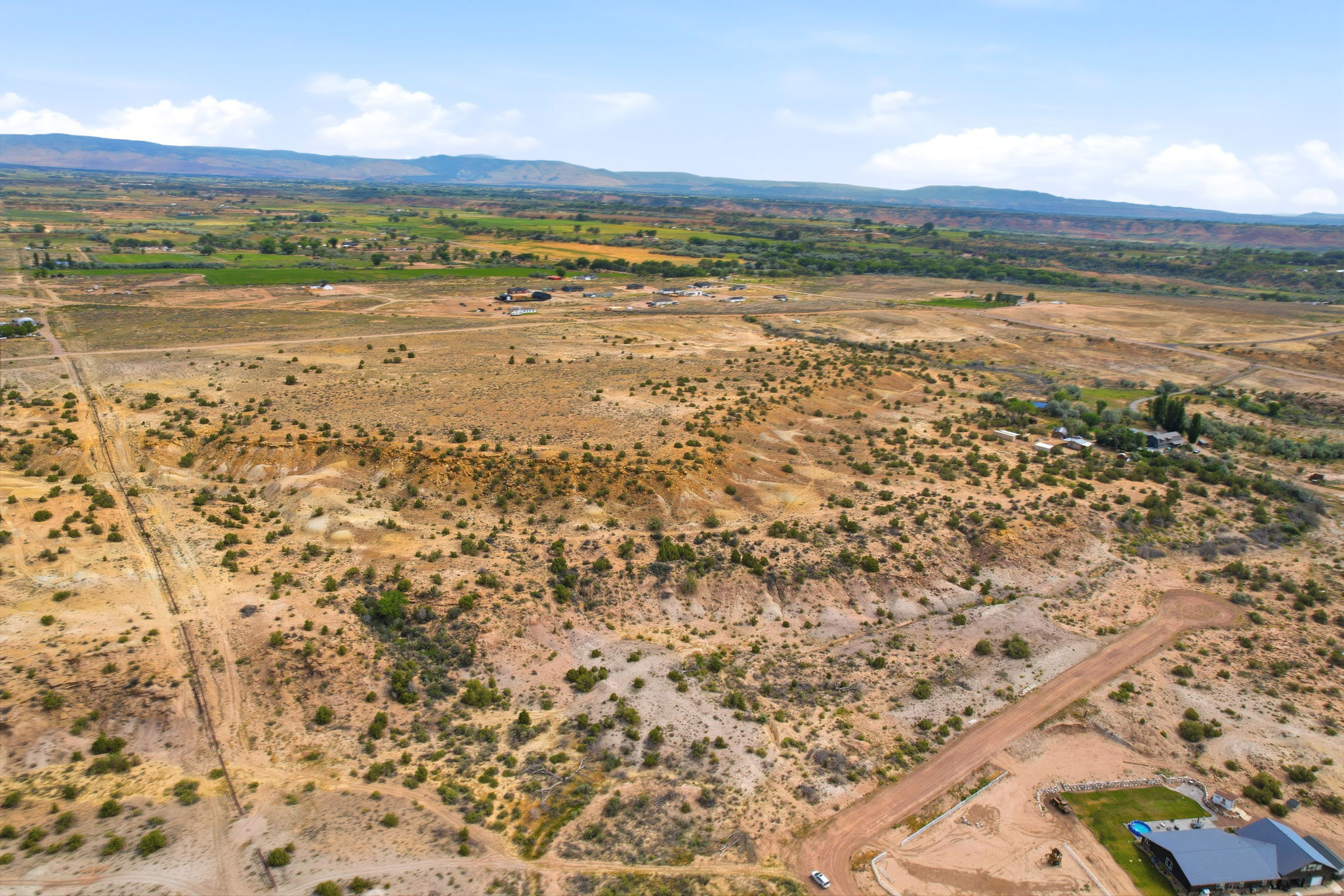 Expansive undeveloped land with a distant mountain backdrop