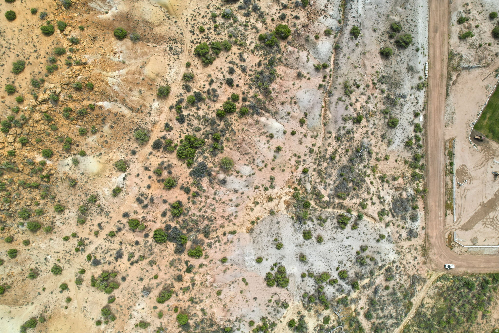 Expansive land parcel featuring natural terrain, varied topography, and established vegetation