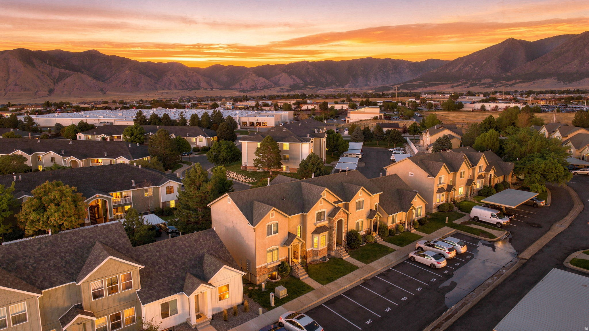Aerial perspective of a neighborhood with mountain backdrop