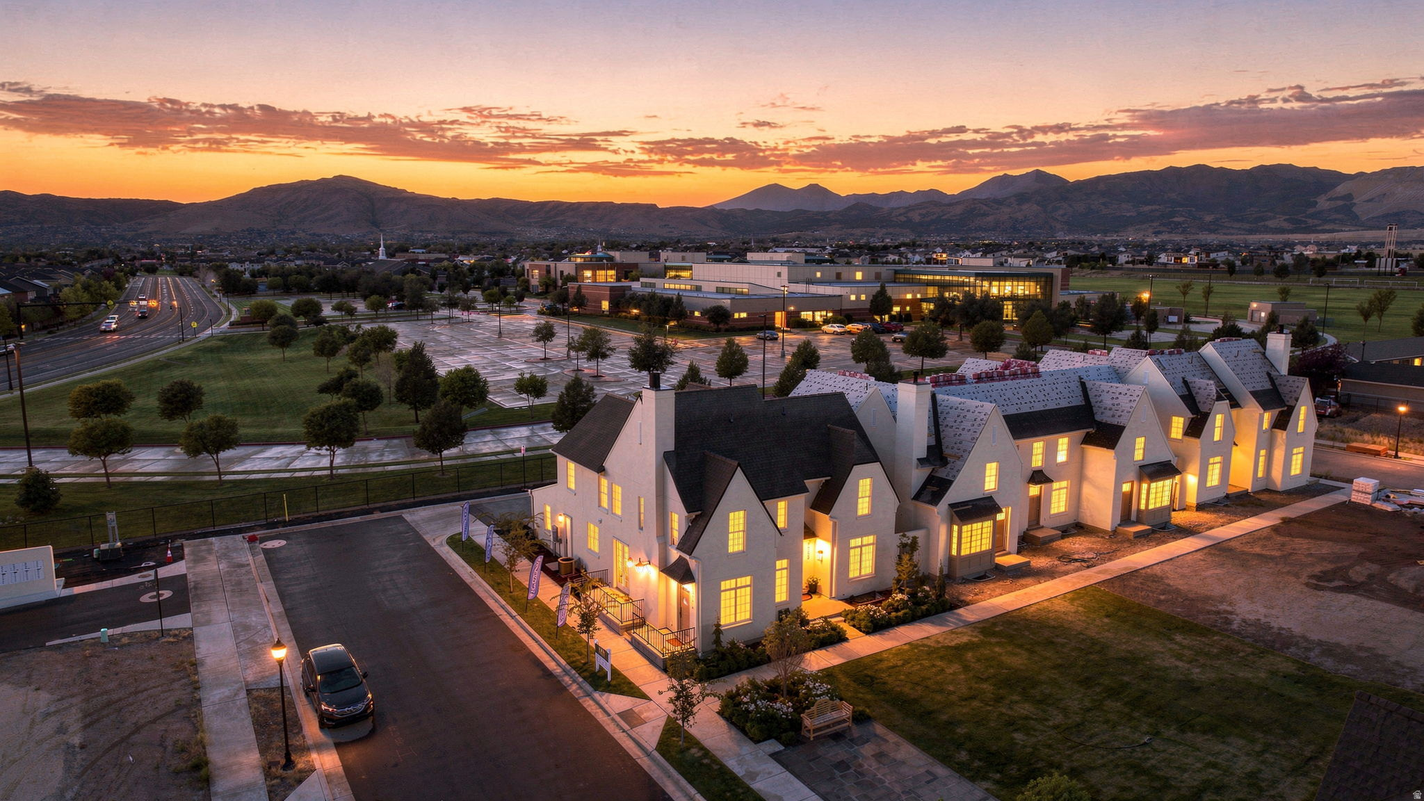 Modern townhome residences with white exteriors and dark roofing