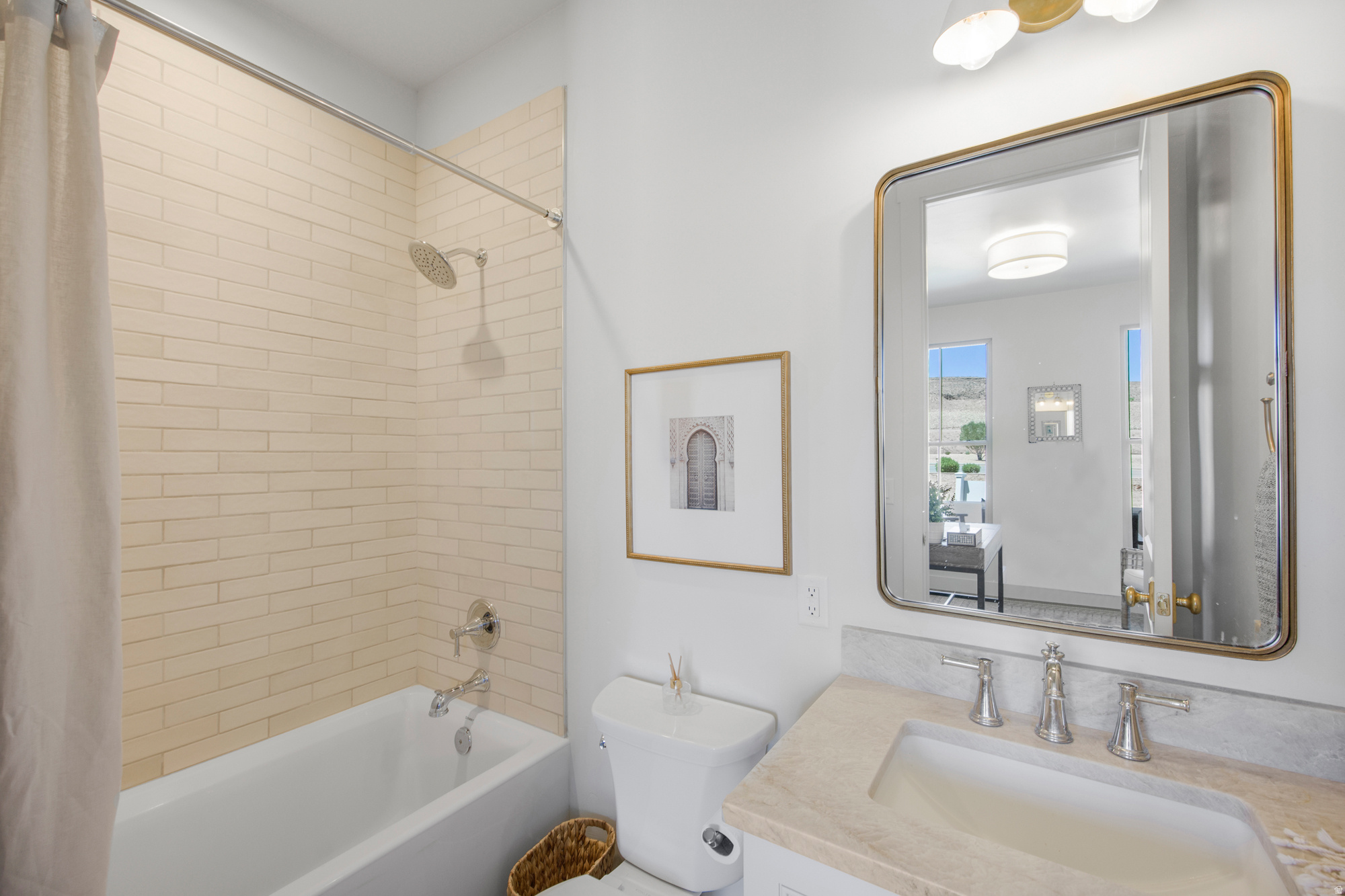 Contemporary bathroom featuring a white bathtub, subway tile shower surround, and chrome shower fixtures