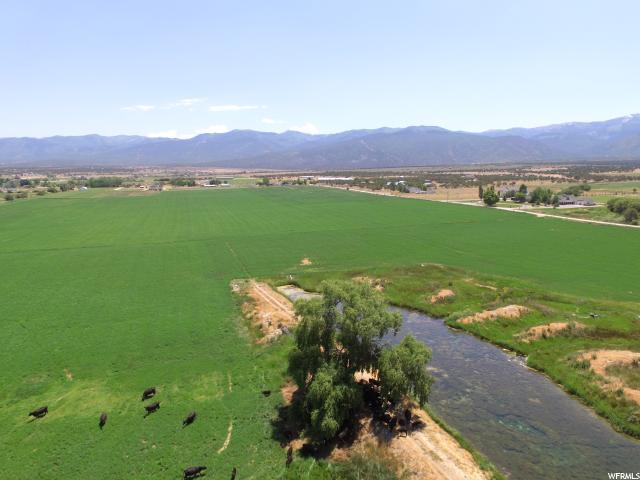 Spring City, Utah 173 of the 185 acres are irrigated. Spring and storage pond provide water for 140 acres, with the balance being irrigated with Horseshoe irrigation rights. The setting is spectacular in the quaint community of Spring City. The irrigation is pressurized. The property front Spring City's 1100 West where there are water and power lines. Price has been reduced twice. Will look at your offers.