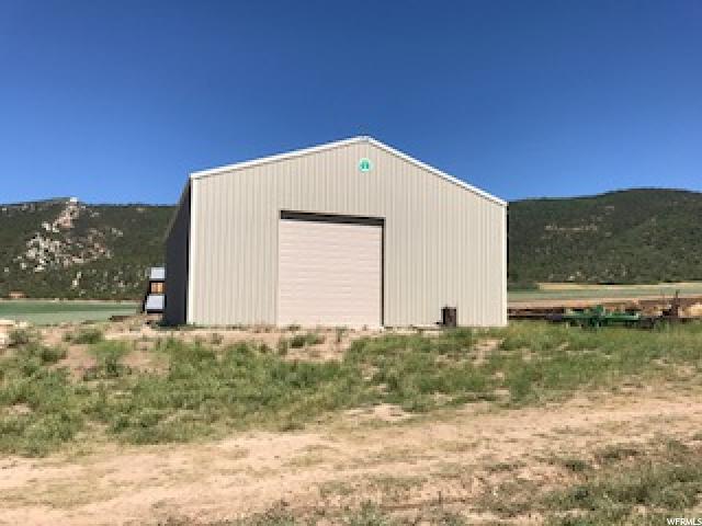 9641 10750 N E Spring City, Utah Beautiful setting at the foothills of Horseshoe Mountain, So East of Spring City on Canal Canyon Road. Brand new 'Cleary' barn 42'X64'X17'(height), with concrete floor and 12'X14' (high) door. Also, picturesque, historical barn. Perfect for horses with Horseshoe Mt. Trail for horses & hikers within 1/2 mile. 50 shares Horseshoe Mt. pressurized irrigation. Call agent for more details.