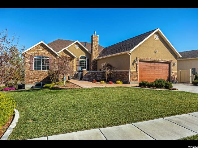 3334 PEREGRINE W S Saratoga Springs, Utah Seller is SERIOUS and just REDUCED his price to prove it. Get over to check out this Saratoga Springs Gem. It has the views, it has the completely finished-walkout basement, it has the bedrooms, it has the open concept, it has the bathrooms, it has the 2nd kitchen in the basement, it has the den, it has the theater room, it has the updated kitchen on the main floor with granite counter tops throughout, it has the formal and semi-formal dining rooms, it has wood floors, and did I mention a deck to enjoy those awesome views of the Valley and lake. So if you are looking for that once in a life time chance, well here it is. Come and see this and get that offer in. Schedule your showing today and see the home and its entire, fully landscaped yard as well. Start the New year off right and make this your new home.