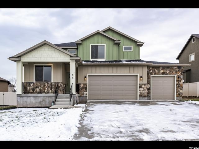 629 SIDNEY LN W 60 Saratoga Springs, Utah OPEN HOUSE Saturday 12/8/18 11:00-3:00 Unbelievable value, upgrades throughout...beautiful, rich laminate hardwood floors, open and bright kitchen with espresso cabinets and granite/quartz countertops....lots of cabinet and counter space for entertaining. No corners cut on these homes....board/baton exterior finish walls with stone (no stucco) Exterior finishes add lots of texture and dimension to this stunning home. Home features upgraded carpet, quartz in bathrooms, soft water, tile shower surrounds, high ceilings, vaults and a great stainless LG appliance package including fridge and GAS range. Front yard landscaping completed in August some of the pix are from before landscaping.