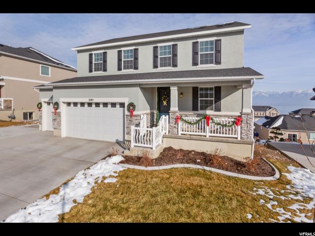 3082 TYTUS LN S Saratoga Springs, Utah Nestled in a friendly neighborhood with astonishing views of Mt Timpanogos and Utah Lake! Boasting upgrades including a 3 car garage, RV parking pad, outside gas line, large dining area, 9 ft ceilings in a full walkout basement, upstairs loft, soft close drawers/cabinets throughout. Gourmet kitchen with 5 burner gas range, in-wall double oven, huge island and pendant lighting, tile backsplash and stainless steel appliances. separate heat/cool zones for main and 2nd floors! Make an appt today! Square footage figures are provided as a courtesy estimate only. Buyer is advised to obtain an independent measurement.