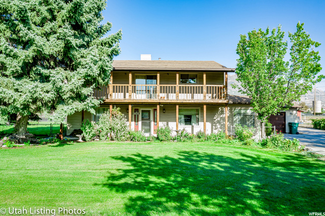 11042 N 5730 W Highland, Utah Amazing!!! This beautiful horse property is located in a quiet Highland neighborhood with exquisite mountain views! The 3-bedroom, 3-bath home has a completely updated kitchen with an amazing gas counter-top range! The property boasts 1.44 acres with beautiful mature fruit and pine trees, a covered deck, and 3 additional outbuildings/barns!!! Don't miss out on this unique property with plenty of room for all your needs!!!
