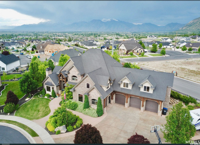 727 E SUNFLOWER S Salem, Utah This amazing 1 acre property has the ABC's of home luxury. A for acreage, B for beautiful view and C for Craftsmanship. This home builder's masterpiece is an 8-bedroom, 5.5 bath, 6 car garages with so many amenities and extra's, for every member of the family to enjoy. The covered patio is the place to roast smore's and catch the ballgame on the drop-down outdoor TV while you relax year-round. Summer fun in the yard and upper patio. For a full view experience please visit the website: 727sunflower.com