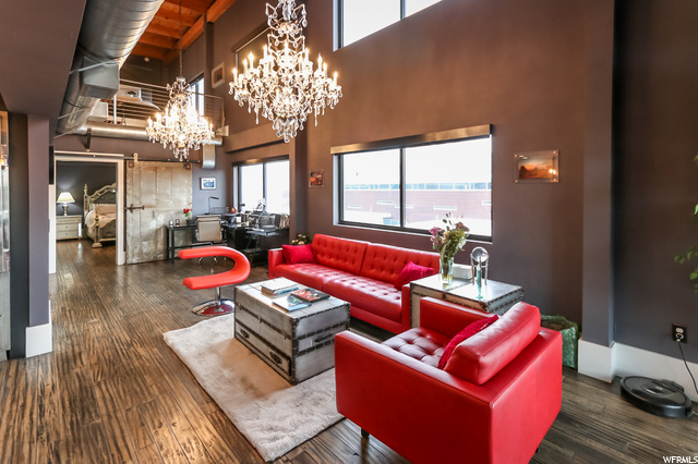 328 W 200 S 601 Salt Lake City, Utah Sublime downtown penthouse loft done in 'Grandmillenial' style decor on both levels-from the retro crystal chandeliers to the comfort of a TV/gaming room, this unit has all the groovy vibe for a lock and leave lifestyle. Tons of light and uninterupted views of downtown and eastern sunrises along the Wasatch-high ceilings and an open floor plan. Huge white marble waterfall island in the kitchen, Asko dishwasher, Wolf gas range and SubZero refrig all stay. Marble subway tiles surround the kitchen counter area and instead of cold concrete floors you get the beauty of wood surfaces. There's a new soft water and continuous hot water heater, but know the best of all is that this building draws from geothermal heat to help save the environmment and owner money. Could there be TWO PARKING spaces? There's parking across the street at the Crane building, and Vosen's bakery is closed at night...but no extra spaces via this HOA. Good storage space on the 4th floor. Seller would negotiate furnishings if buyer is interested. Read agent remarks for showing information.