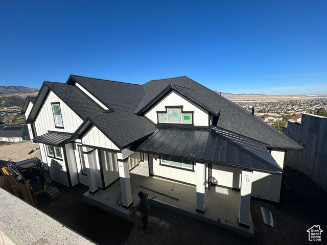 Back of house with a mountain view