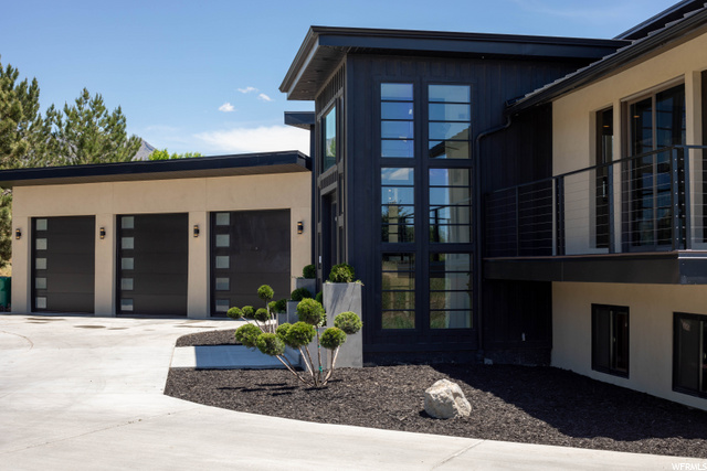 Front side exterior w/ garage.