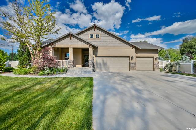 33 S 850 W Lehi, Utah Wonderful home located in the center of Lehi City on a corner lot with great curb appeal. Open floor plan on main level with vaulted ceilings and fireplace in family room. Kitchen features Corian countertops, recessed lighting, gas range, and lots of cupboard space. Primary bedroom on main level with large primary bathroom, separate tub and shower, double sinks, walk in closet, and separate water closet. Laundry and additional bedroom on main level. Basement with two bedrooms, a full bath, a large family room, and kitchenette that has refrigerator, sink, and disposal. Unfinished room that can be turned into an additional bedroom or in home gym. No HOA. Large tuff shed can be used for storage. Heated and cooled 3 car garage with fully insulated garage doors and 3 car driveway. Fully fenced backyard with large covered patio and awning for wonderful entertainment opportunities with a well maintained garden. Central Vac, In Wall Speakers, Intercom and other added features like newer Water softener, AC, and furnace. Check out the 3D tour and schedule a tour today!