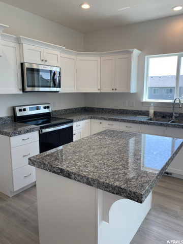 White cabinets w/ Granite Countertops