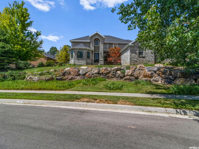 11579 MERCER HOLW Highland, Utah Come see your beautiful home! Take advantage of this huge home! And HUGE BONUS you will love the neighborhood! Not only do you buy a HOME - you are buying the neighborhood. With the parks close by and the friendliness of the neighbors ... it will be the perfect place for YOUR FAMILY! Offering over 6500 square feet you will enjoy the benefits of the desirable DRY CREEK ESTATES. Nestled in the Highland East bench you are within walking distance to two PARKS and the renowned Ridgeline Elementary school. Plenty of storage from the 5 closets/cubbies off of the garage, to the oversized storage room in the basement, and all the extra built-in closet spaces. Close to everything: shopping, restaurants, entertainment, and easy access to I-15! There are plenty of features & benefits including, MAIN LEVEL LIVING- master on the main floor, large windows & natural light, vaulted ceilings, 3 car garage, separate BASEMENT ENTRY, with plumbing for a second kitchen and laundry room (mother-in-law/legal accessory opportunity), 2 fireplaces, two-toned paint, OPEN KITCHEN with Large WALK-IN PANTRY, double ovens, GRANITE counters, 2 HOME OFFICES (the one on the second floor has breathtaking mountain views), 4 bedrooms and two Jack and Jill bathrooms on the second floor. Mature trees, with FRUIT TREES, 2 peach and a cherry tree, strawberry and blackberry bushes. Check out the VIRTUAL TOUR - http://utah-virtual-tours.scatterscape.com/?TourID=1758838