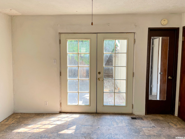 Dining area French doors and door to flex area