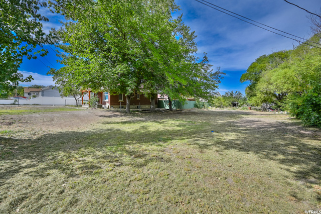 7476 W 3100 S 42 Magna, Utah **MULTIPLE OFFERS RECEIVED. NO MORE SHOWINGS PER SELLERS REQUEST** Huge fully fenced lot for animals and space with mature trees and wildlife. Rural property feel but not far from anything. May have the potential to be subdivided or used as horse property. Sale includes parcel numbers: 14-28-251-039-0000, 14-28-251-052-0000 and 14-28-251-055-0000. Property has a bungalow and out buildings on it. Property to be Sold in it's "As-Is" condition.