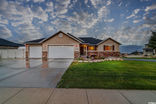 372 W REMINGTON AVE N Saratoga Springs, Utah Checks every box! Massive yard, 3rd car garage and RV parking, Views Galore, No HOA, fireplace (indoor and out) and quiet neighborhood! Possibility of adding an ADU apartment. The home has a new HVAC and 50 gallon water heater, tall daylight and walkout basement Includes Washer, Dryer, Fridge, Home Security cameras Smart System w/bulbs, outdoor fireplace, whole home speakers, and tablet control center.