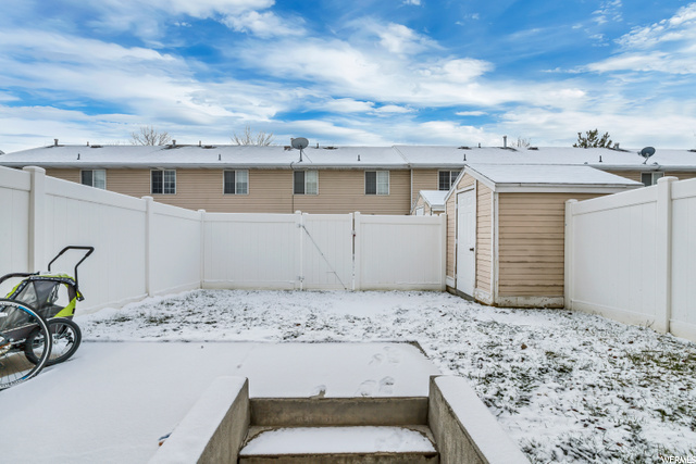 Spacious backyard with storage shed.