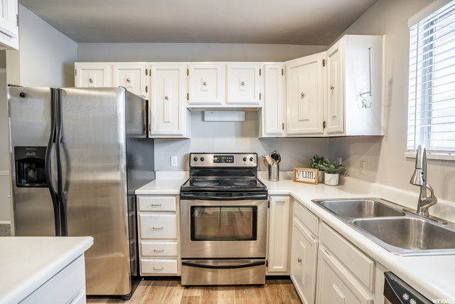 Painted white cabinets in kitchen.