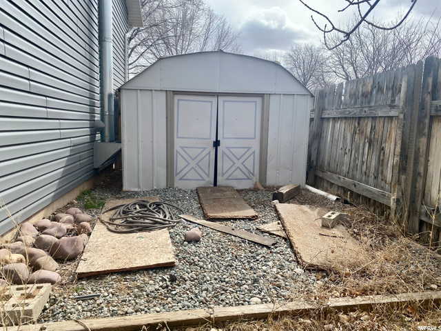 metal storage shed in backyard