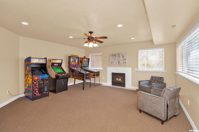 family room and game room with fireplace