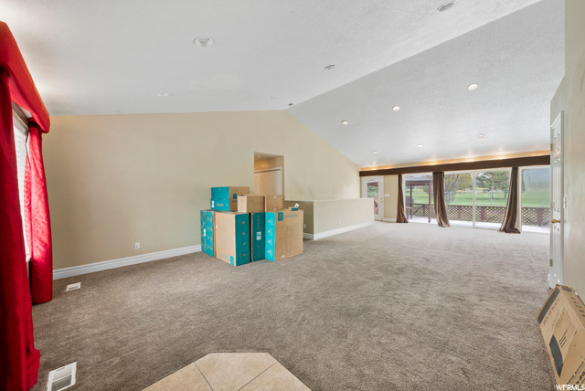 The back of the family room features a wall of large picture windows to showcase the magnificent views this home offers of the golf course and American Fork canyon.
